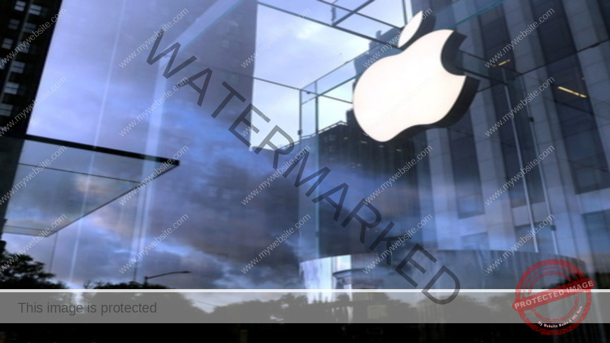 FILE PHOTO: The Apple Inc. logo is seen hanging at the entrance to the Apple store on 5th Avenue in Manhattan, New York, U.S., October 16, 2019. REUTERS/Mike Segar